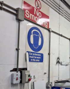 hearing protection sign on a wall