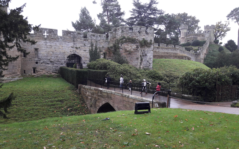 view of castle and bridge with railings